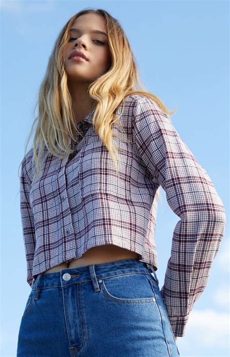 girl wearing only flannel shirt.